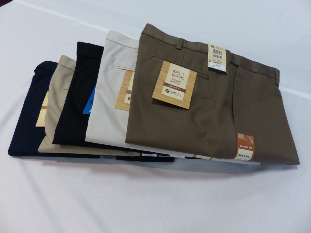 Libin’s Menswear store interior with clothing racks and promotional signage